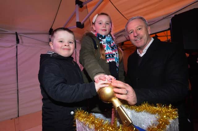 Pallion Christmas light switch on.
Archie Holder-McNish 5, sister Lily 10 with Kevin Ball