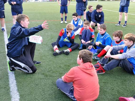 Youngsters get a briefing from their coach during an FA competition in the North East.