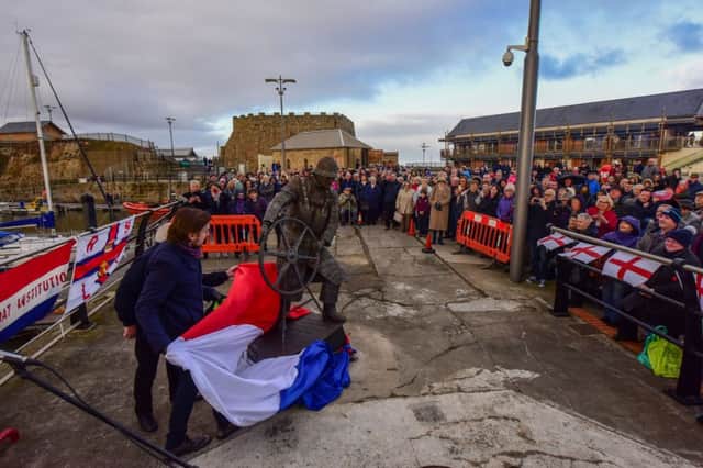 John Knight Head of Lifesaving R.N.L.I. unveils the new Ray Lonsdale staue - The Coxswain - at Seaham Harbour Marina