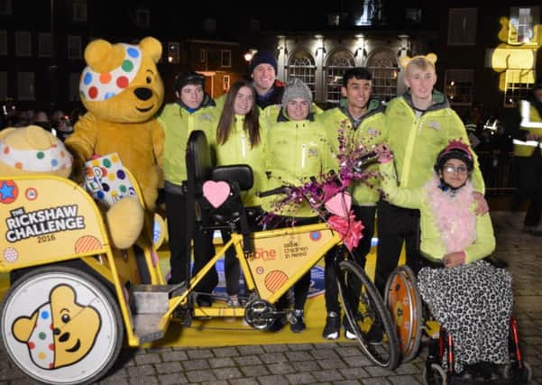 Ross Jackson, far left, along with the rest of the Rickshaw Challenge team.