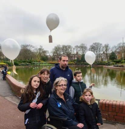 The family of Michelle Massey who died aged 30, partner Paul Thompson, their children Alisha (8) Lewis (11) and Jessica (5), Michelle's mum Iris Masssy (in wheelchair) and Paul's mum Iris Thompson, realeasing balloons on a walk through Roker Park on Sunday on what would have been Michelle's birthady.