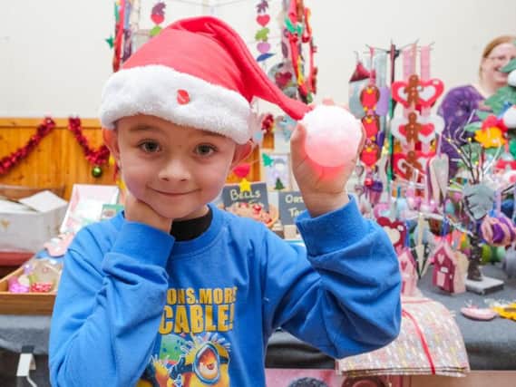 Connor Miller, from Marsden, gets into the Christmas spirit at last year's event.