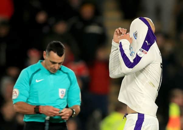 Jonjo Shelvey covers up after his penalty miss at Hull