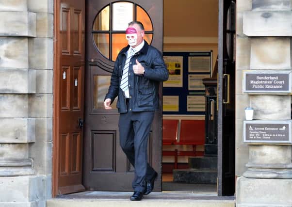 Vesta Tilley's former manager Mark Hardy leaves court wearing a mask