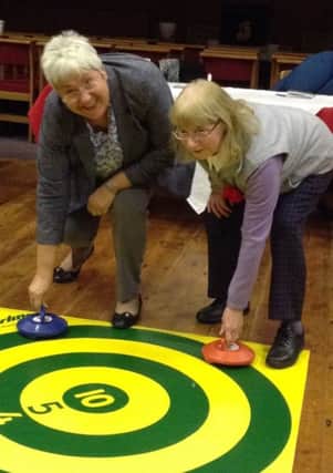Marjorie Snaith and Mildred Charlton playing New Age Kurling at Tunstall WI.
