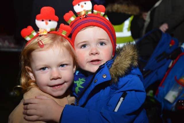 Cousins Lola Mason, aged two, and Jesse Appleby, also aged two, enjoy the switch-on.