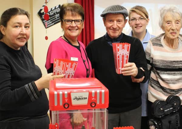 At the opening of Barnes Court's cinema are, from left, resident Giselle Hughes, activities co-ordinator Julie Haram, resident Tommy Killala, care assistant Laura Adams and resident Margaret Davies.