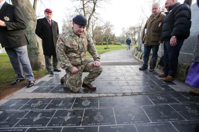 L/Cpl Gary Lowthian looks at his and his grandfather's stone on the new Veteran's Walk pathway in Mowbray Park, Sunderland. Picture: TOM BANKS