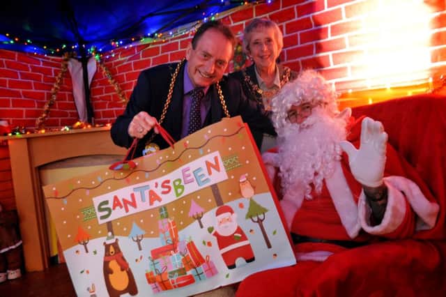 The Mayor of South Tyneside, Coun Alan Smith, and Mayoress Coun Moira Smith, join Santa in his grotto at Whitburn Village's Winter Festival, held at the Barnes Institute.