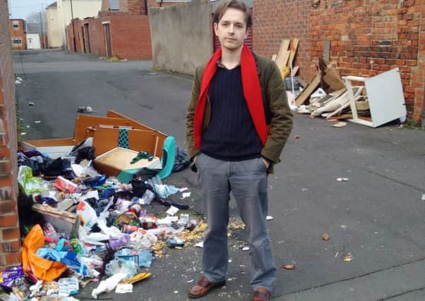 Councillor Niall Hodson with the waste said to be tipped out by a bin raker in Millfield.