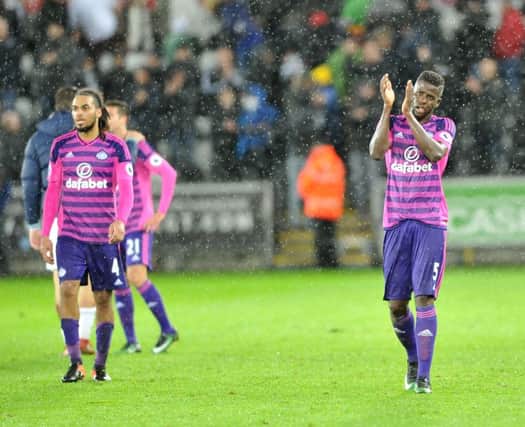Papy Djilobodji applauds the Sunderland fans at the end of the game
