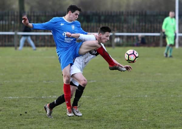 Hall Farm Glasshus  (blue) take on Coxhoe Athletic in last week's Durham County Trophy quarter-final. Picture by Tom Banks