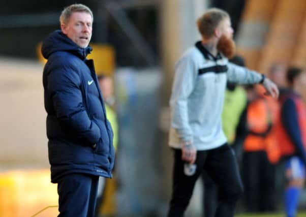 Craig Hignett watches his men slump to a 4-0 defeat at Port Vale last week