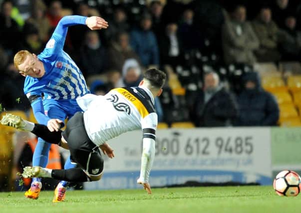 Pools' Michael Woods goes flying in last weekend's FA Cup defeat at Port Vale. Picture by Frank Reid