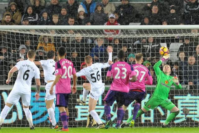 Jordan Pickford makes a save against Swansea City