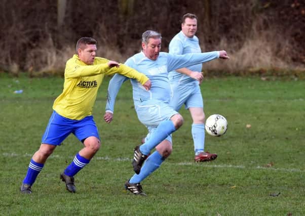 Action from the Oddies Over-40s (yellow) game against Rolls Royce. Picture by Craig Leng