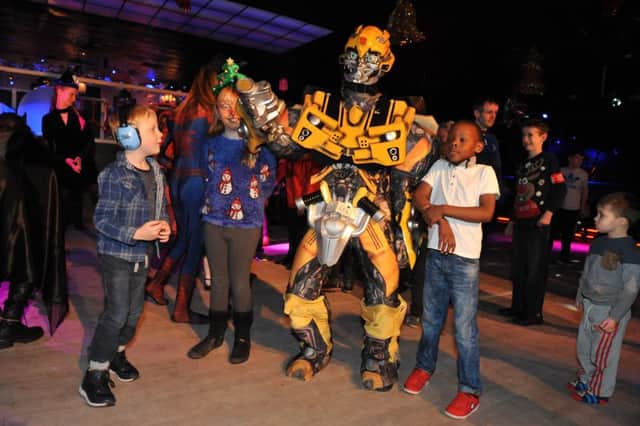 Youngsters meet a Transformer at the Hope4kidz Christmas party, at Illusions nightclub, Holmside, Sunderland.