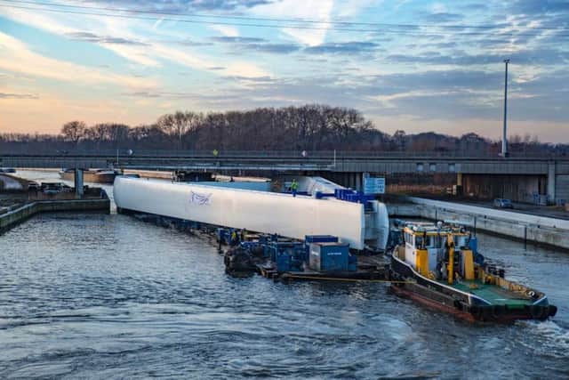 The pylon being transported by canal to the Port of Ghent in Belgium.