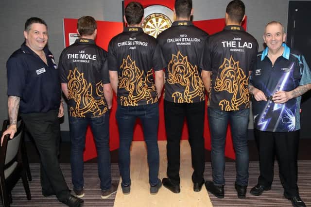 Darts players Gary Anderson (left) and Phil Taylor with members of the Sunderland first team squad Lee Cattermole, Billy Jones, Vito Mannone and Jack Rodwell.