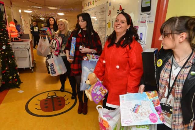 Fundraiser Emma Olsen (middle) with team ready to hand out Christmas presents on the children ward at Sunderland Royal Hospital