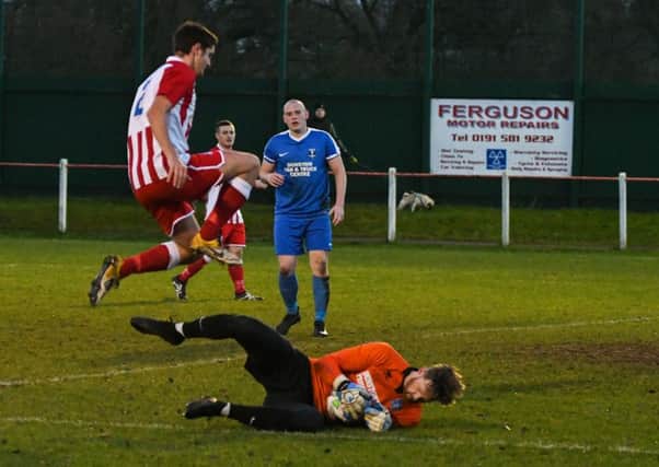 Dunston UTS keeper Stefan Holden saves the day against Seaham Red Star (red and white) on Saturday. Picture by Kevin Brady