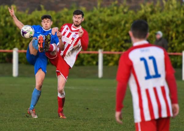 Seaham Red Star (red) battle against Dunston UTS  at Seaham Town Park on Saturday. Picture by Kevin Brady