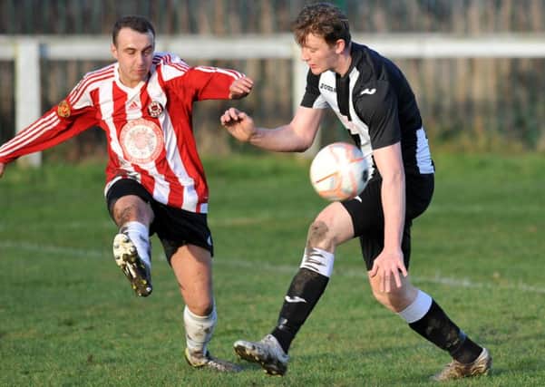 Sunderland West End (red and white) battle against Boldon CA in their Shipowners Cup tie. Picture by Tim Richardson