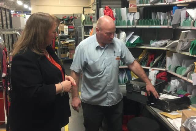 MP Sharon Hodgson talks to a postal worker during her visit.