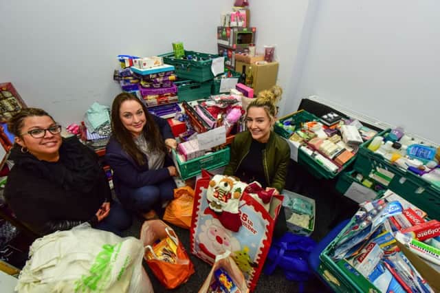 Volunteers Julie Cahill (left) and Beth Carruthers (right) with Jo Benham (centre) of the Key Project, Baring Street South Shields wth some of the donations collected to help the homeless.