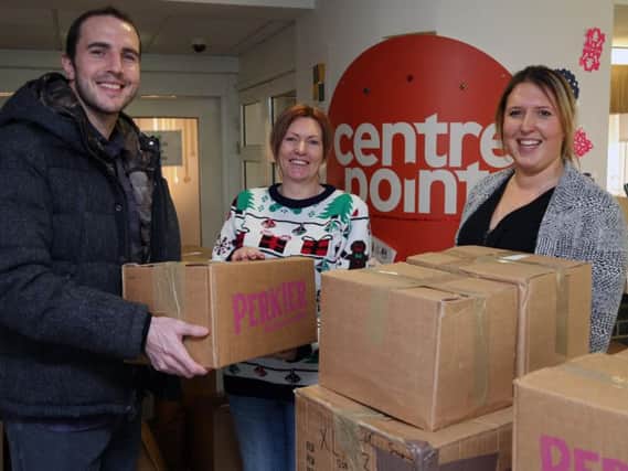 John O'Shea delivers Christmas donations to Emma Richardson, Service Manager at Dundas Street, and Jennifer Foster, Head of Housing and Support (North).