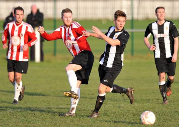 Sunderland West End (red and white) battle Wearside League rivals Boldon CA in last week's Shipowners Cup tie. Picture by Tim Richardson