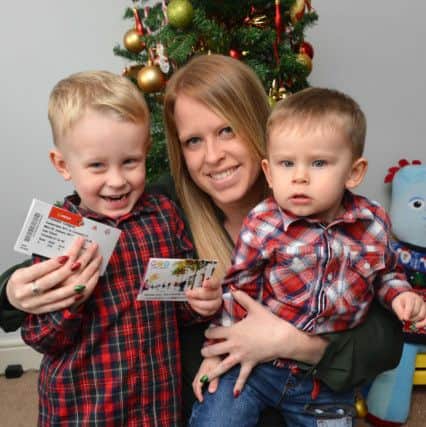 Oliver Patterson, 3, winner of the Dear Santa competition, pictured with mum Lana Stoker and young brother Jack Patterson, 1.