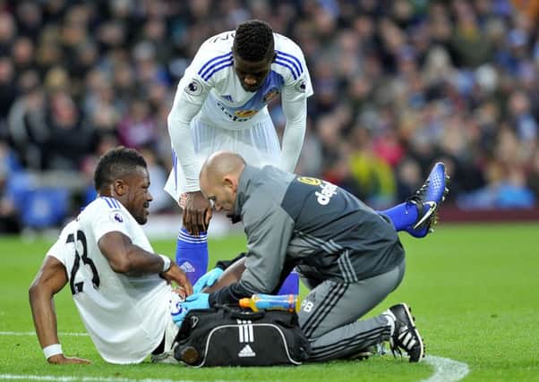 Lamine Kone receives treatment before going off injured against Burnley on Saturday. Picture by Frank Reid