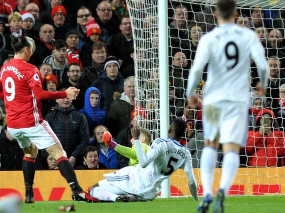 Jordan Pickford in action against Manchester United.