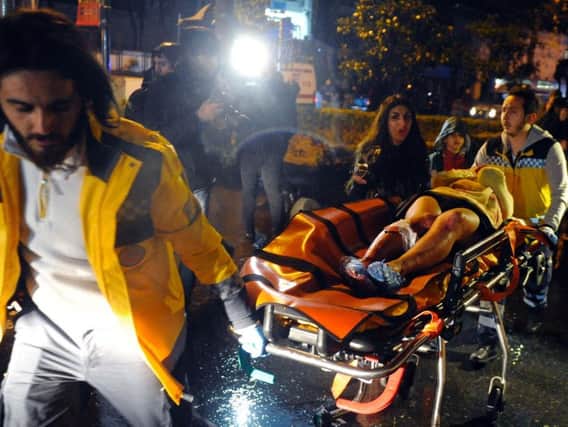 One of the wounded clubbers injured in the New Year's Eve nightclub attack in Istanbul is taken for treatment.