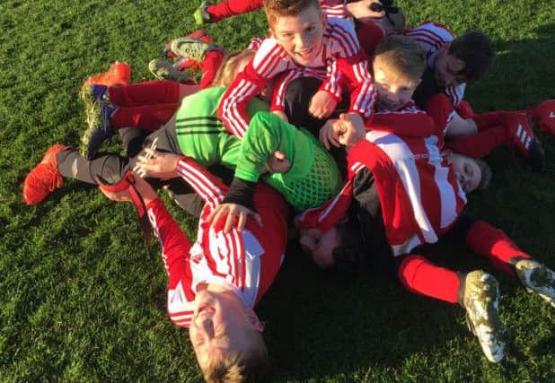 Sunderland Primary Schools Boys celebrate ths final goal in their 6-2 defeat of Newcastle