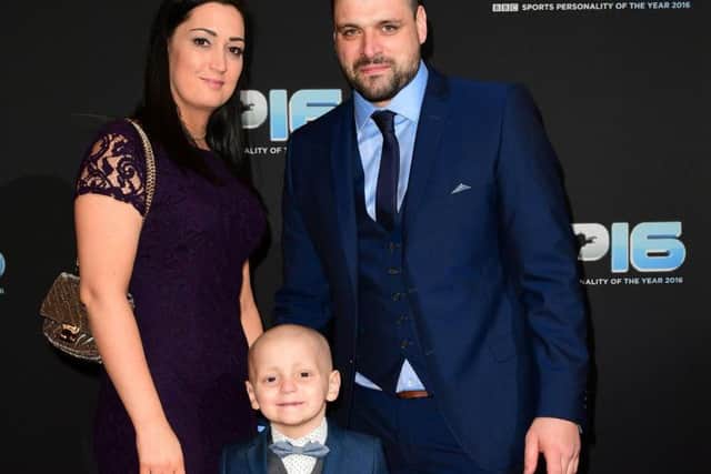 Bradley Lowery with mum Gemma and dad Carl at the Sports Personality of the Year awards. Pic: PA.