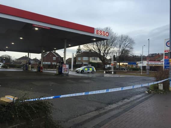 Police on scene at the petrol station.