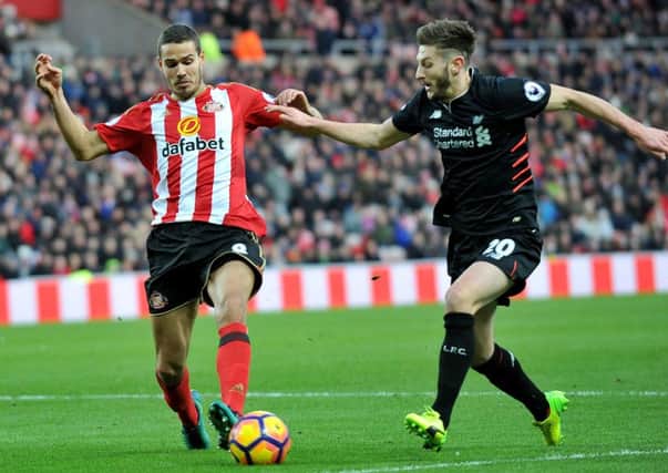Jack Rodwell beats Adam Lallana to the ball in Mondays 2-2 draw against Liverpool at the Stadium of Light. Picture: by FRANK REID