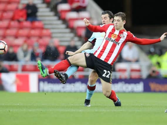 Joey Barton challenges Sunderland midfielder Donald Love