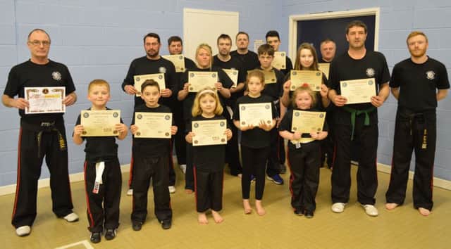 Sacred Dragon Kickboxing students with their awards.