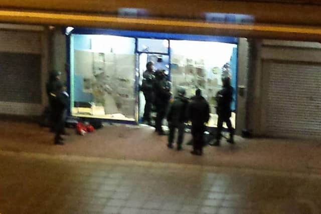 Police outside the Coral bookmaker in Jarrow on Sunday night. Picture by Stephen Dixon.