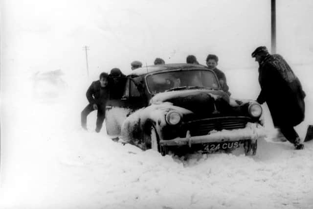 Pushing a car to safety in January 1963.