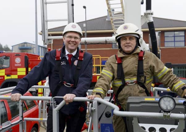Coun Nick Forbes, left, and Tyne and Wear Fire Service watch manager Dave Summers.