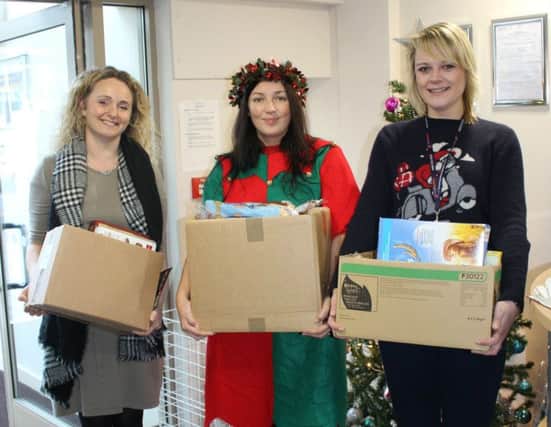 Annmarie Sirs (middle) and Kirsty Hewitt (right) both from East Durham Homes, donate food to Lindsey Wood (left), of East Durham Trusts, for the FEED project.