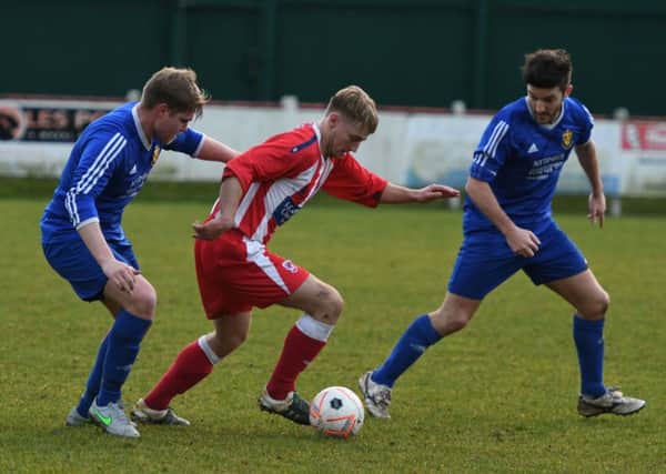 Seaham Red Star Reserves (red and white) battle in vain against Richmond Town in last weeks mauling. Picture by Kevin Brady