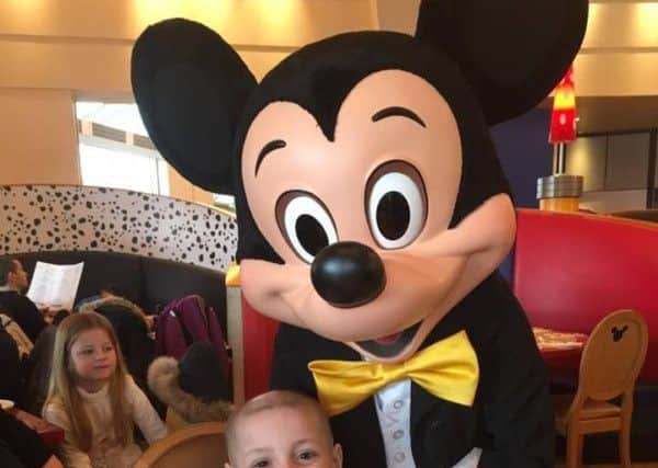 Bradley Lowery meets Mickey Mouse on his dream trip to Disneyland Paris