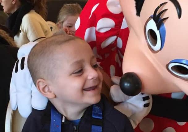 Bradley Lowery gets up close and personal with Minnie Mouse