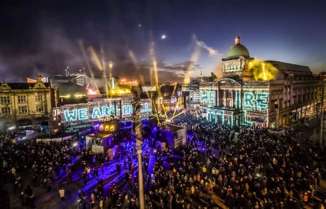 An installation titled We Are Hull by artist Zolst Balogh is projected onto buildings in the city's Queen Victoria Square, marking the official opening of Hull's tenure as UK City of Culture. Credit:  Danny Lawson/PA Wire