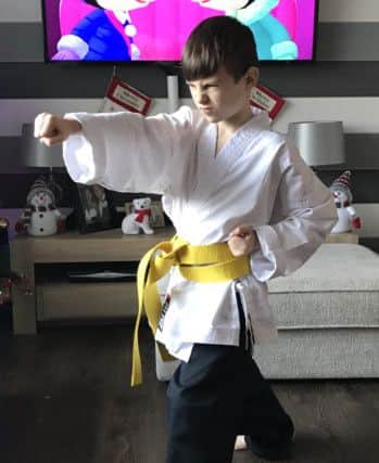 Hayden Wilson, 8, has gained two grades in one at karate.